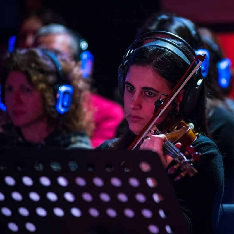 Abaton Live by Kekko Fornarelli Violinist with wireless headphones at Kekko Fornarelli's Abaton concert