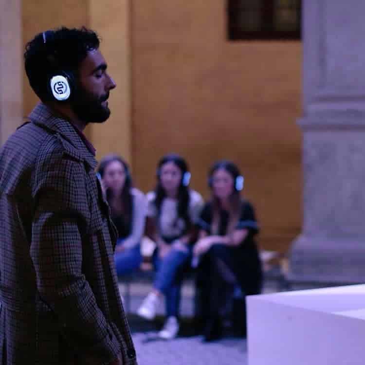 Marco Mengoni Marco Mengoni with Silentsystem wireless headphones in front of the audience