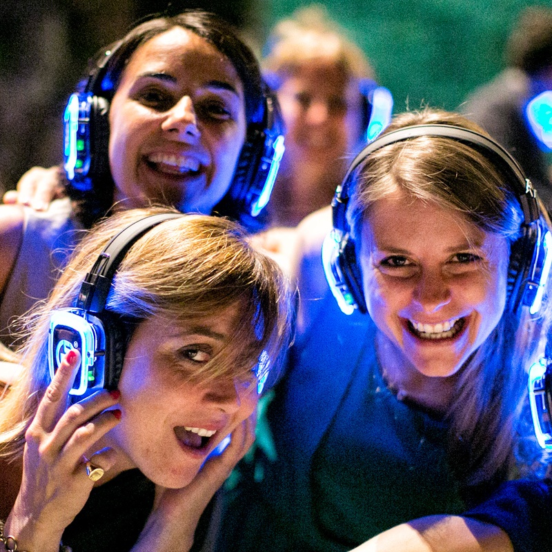 matrimonio5 Smiling guests wearing blue LED silent disco headphones